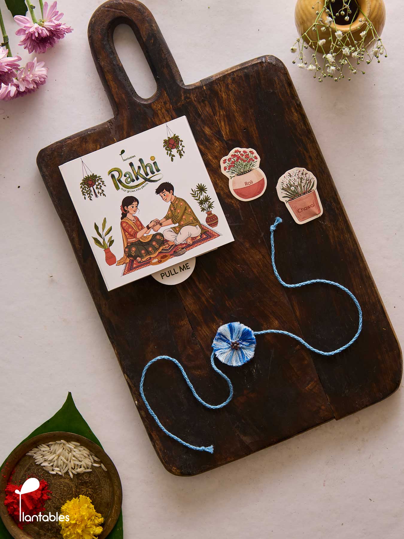 Evil Eye Thread Rakhi, blue nazar motif on cotton thread with seed paper